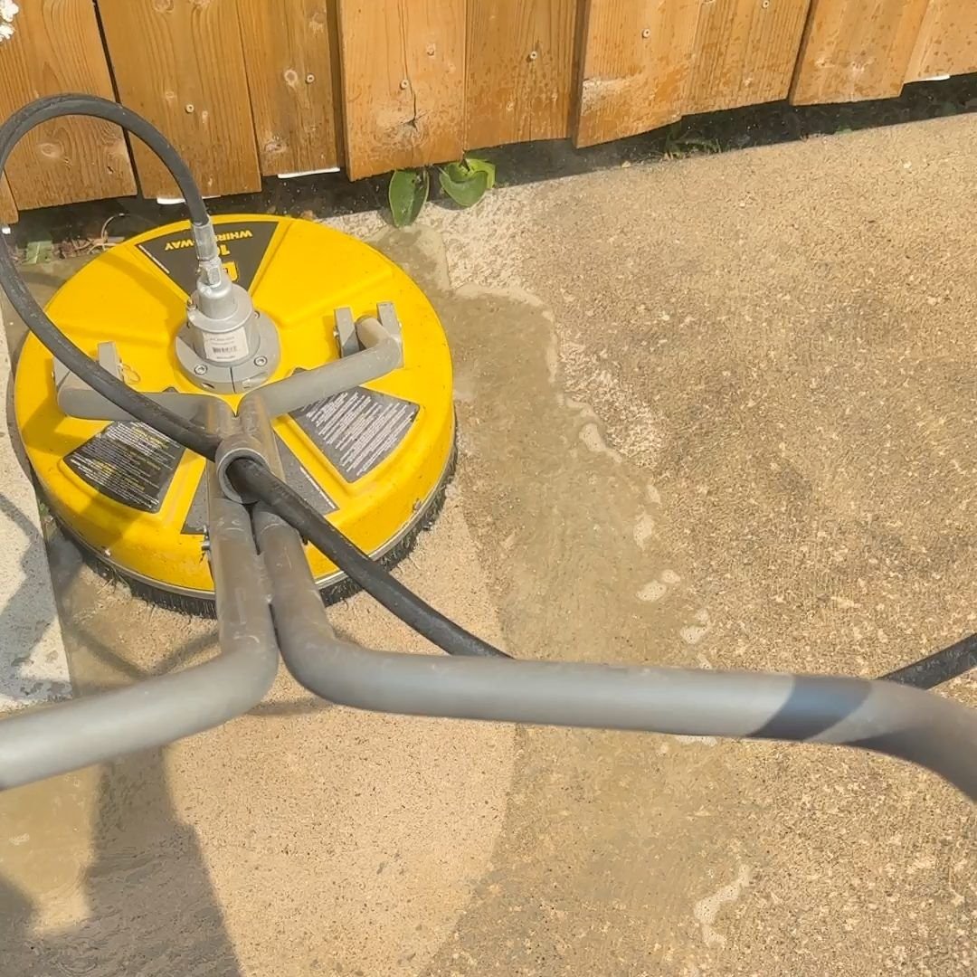 Surface cleaner attachment pressure washing a concrete driveway