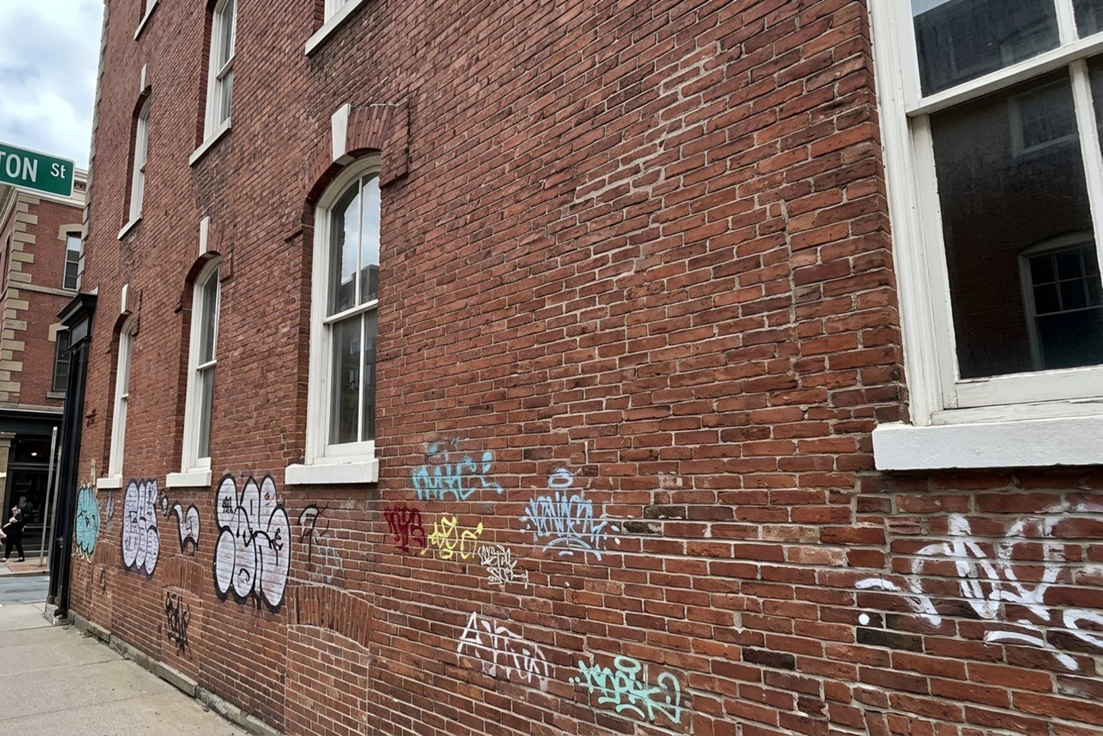WashCrafters graffiti removal on an exterior wall